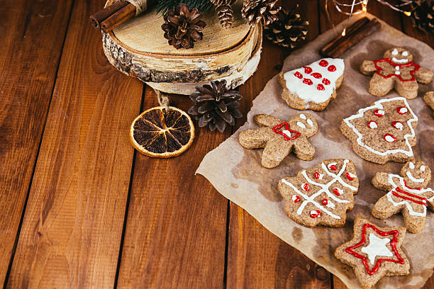 istock Wooden boards with gingerbread cookies with space for text 2250311481