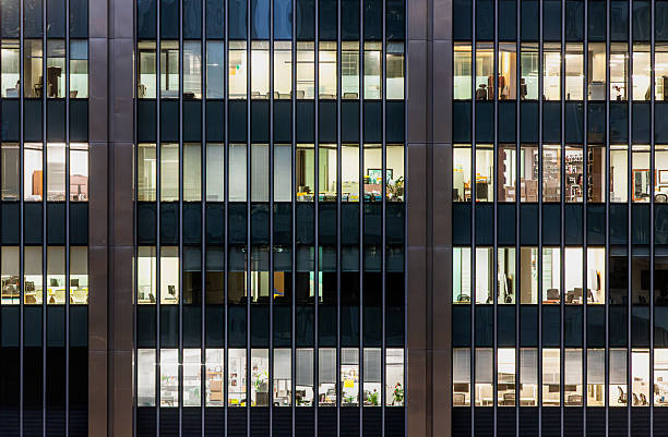 istock Downtown Montreal office towers with illuminated windows at dusk 2250319000