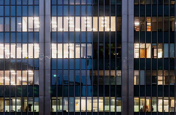 istock Downtown Montreal office towers with illuminated windows at dusk 2250319004