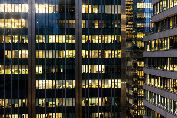 istock Downtown Montreal office towers with illuminated windows at dusk 2250319005