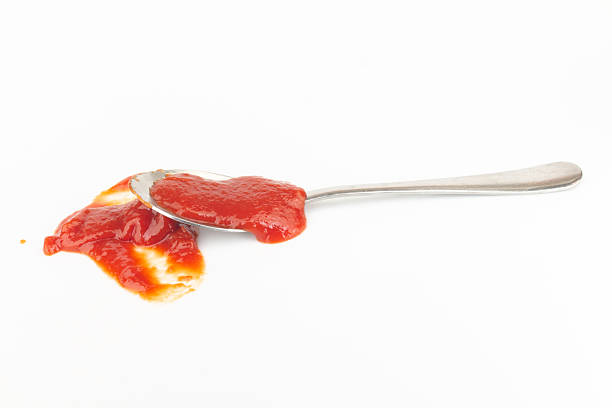 tomato ketchup isolated on white background spoon.