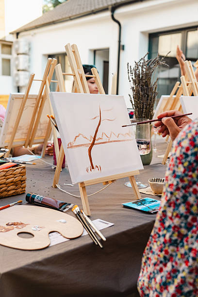 istock Art class with easels, paintbrushes, and a palette for creative painting 2250321661