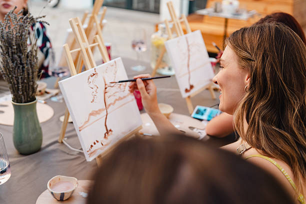 istock Art class with friends painting on canvas 2250321695