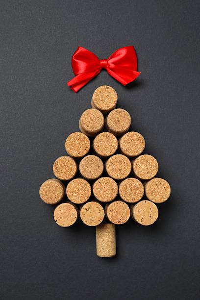 istock Christmas tree shaped wine corks on black background. Top view with copy space for text 2250327891
