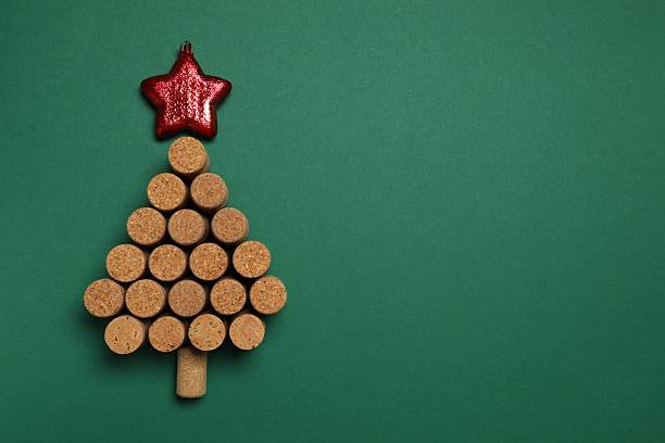 istock Christmas tree shaped wine corks on color background. Top view with copy space for text 2250327892