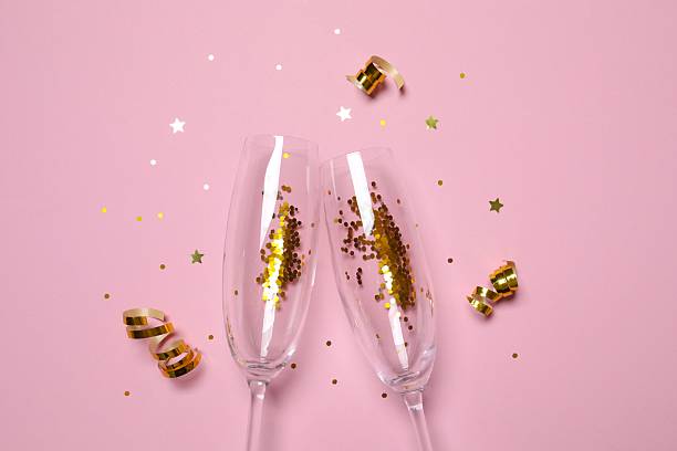 istock Festive background with champagne glasses and confetti 2250327936