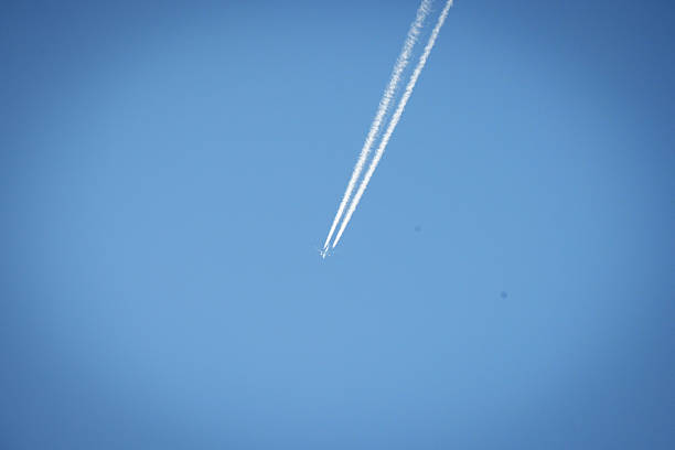 Jet Plane with Contrails in Clear Blue Sky. High quality photo