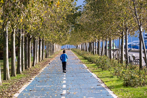 Sunset bike on autumn fall wood bridge at Parque de Turia of Valencia park in spain