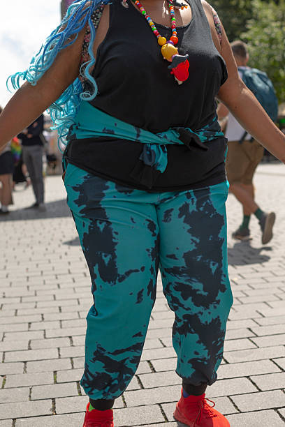istock dynamic dancer sporting bright clothing moving energetically among blurred festival attendees and stalls 2250344166