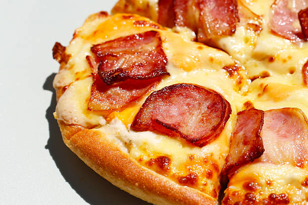 A delicious small bacon and cheese pizza
