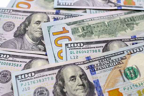 istock U.S. one hundred dollar banknotes. 2250346976
