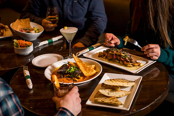 istock Friends enjoy meal at pub 2250348558