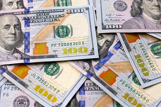 istock U.S. one hundred dollar banknotes. 2250349387