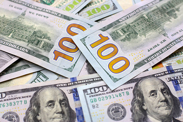 istock U.S. one hundred dollar banknotes. 2250349554