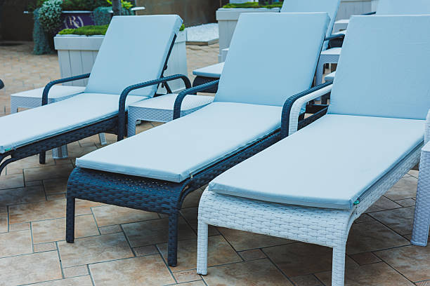 istock Deckchairs stand in a row near the pool, places for comfortable relaxation on deckchairs 2250351880