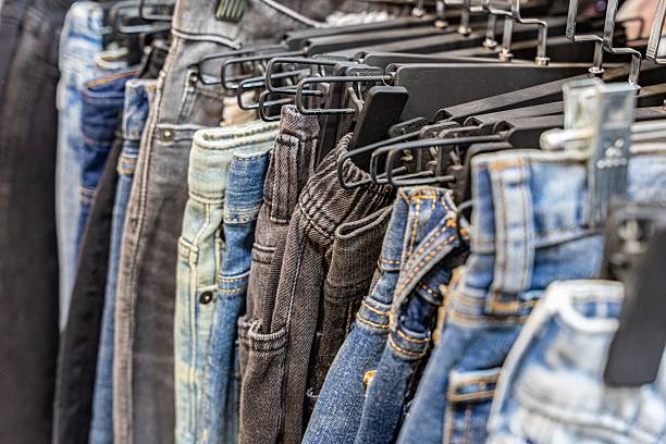 istock Variety of Jeans Hanging on Racks 2250353920