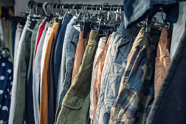 istock Variety of Pants Displayed on Hangers 2250353948