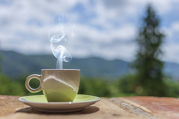 istock Steaming cup of coffee outdoors 2250360910