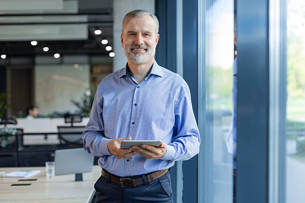 istock Handsome businessman using his tablet in the office. 2250361927