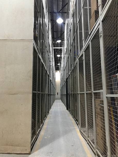 istock Long Corridor of Mesh Wire Industrial Storage Lockers 2250369399