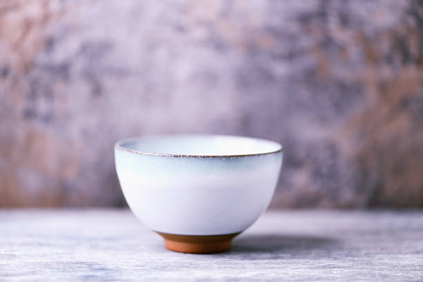 istock Traditional japanese ceramic on rustic wooden background. Soft focus. Copy space. 2250371058