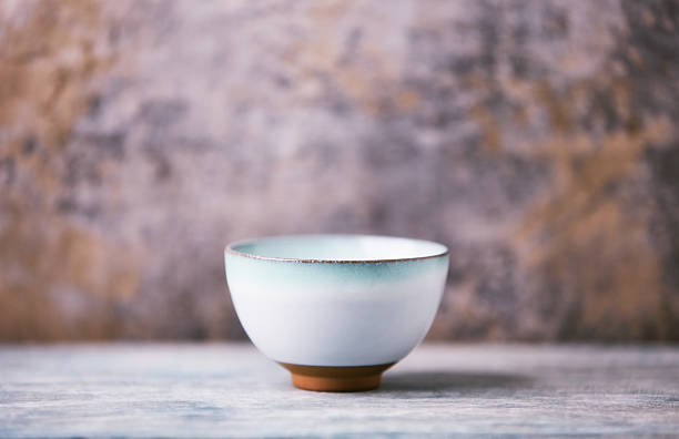 istock Traditional japanese ceramic on rustic wooden background. Soft focus. Copy space. 2250371067