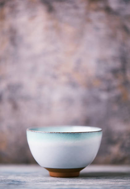 istock Traditional japanese ceramic on rustic wooden background. Soft focus. Copy space. 2250371578