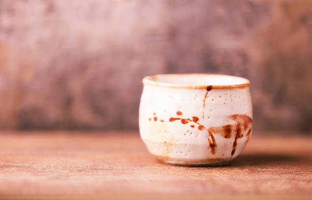 Traditional japanese ceramic on rustic wooden background. Soft focus. Copy space.