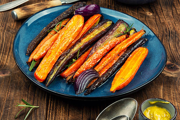 istock Delicious roasted baby carrots. 2250372598