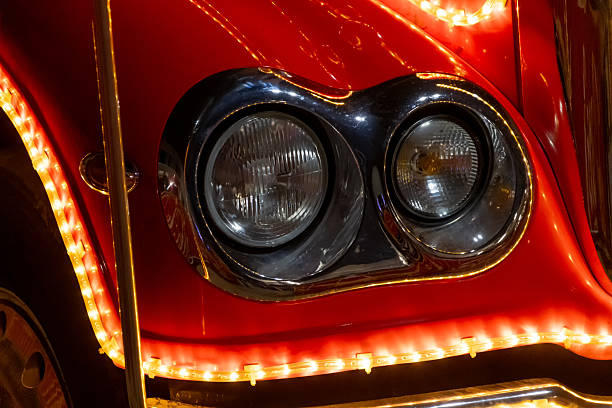 istock The holiday truck's headlight is on fire, close-up. 2250376575