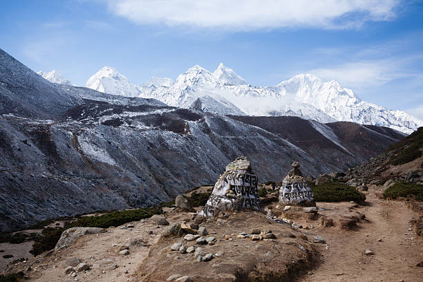 tack of balanced stones at beach against Majestic mountain peaks of the greater Himalayas, en route Manali to Leh, Himachal Pradesh