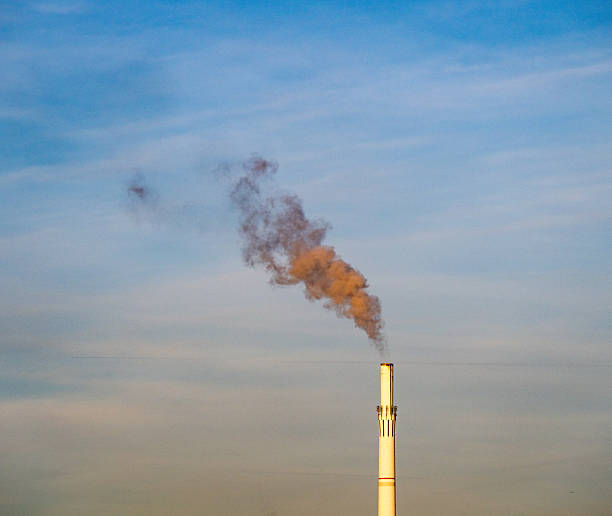 istock Smoke rises from an industrial chimney. 2250380651