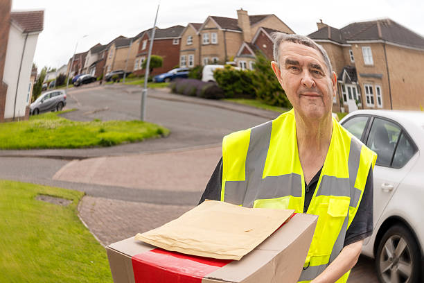 istock Distorted Doorbell Camera View of Courier Holding Parcel at Front Entrance 2250381376