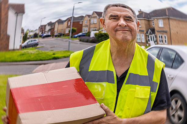 istock Distorted Doorbell Camera View of Courier Holding Parcel at Front Entrance 2250381415
