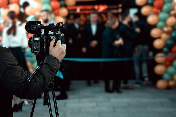 istock The cameraman is skillfully operating and filming with a professional digital camera 2250385398