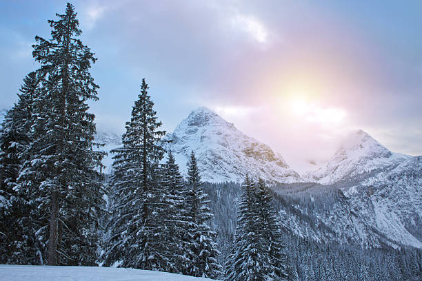 istock Winter landscape with sunset and Alpine mountains 2250386225