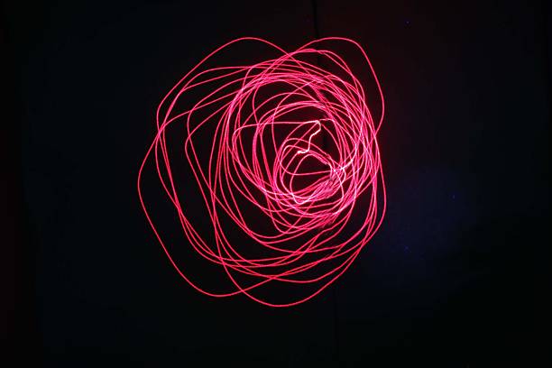 istock Laser trajectory in a black background. 2250389394