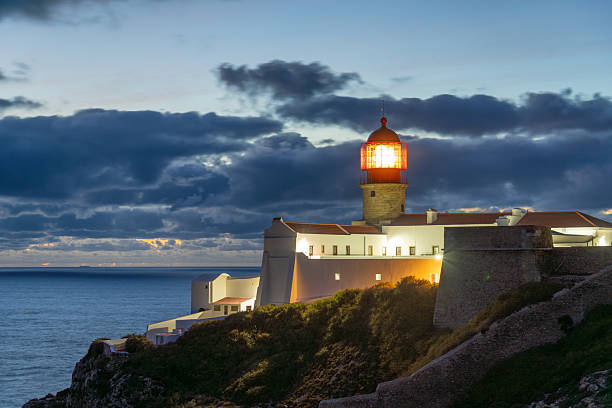 istock Illuminated Ponta da Piedade Lighthouse and Atlantic Ocean at Evening Twilight. Algarve, Portugal 2250391004