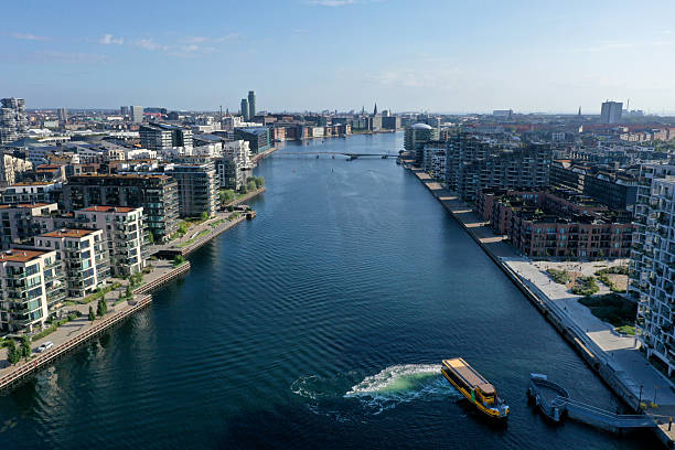 Copenhagen, Denmark August 08,2025:Beautiful Copenhagen City with Harbor and residential buildings. With focus on the residential districts Holmene and København SV. Captured during a sunny day in summer season wit a public waterbus.