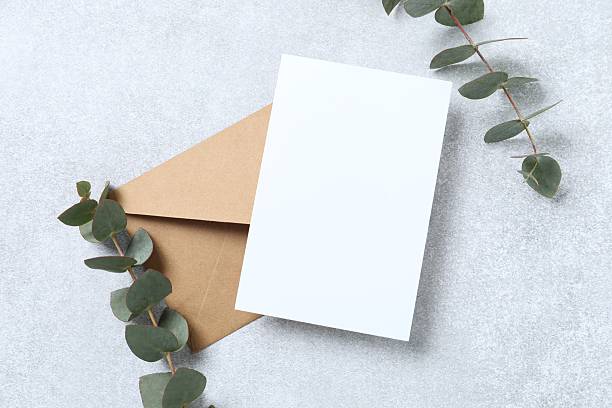 istock Romantic flat lay witn paper envelope, blank card, eucalyptus branches on marble. Ideal for wedding invitations, event announcements, or feminine branding 2250393324