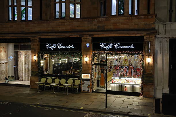 London, United Kingdom - November 17, 2025: Caffe Concerto near Green Park illuminated with warm Christmas decorations, festive lights and seasonal window displays in the evening.