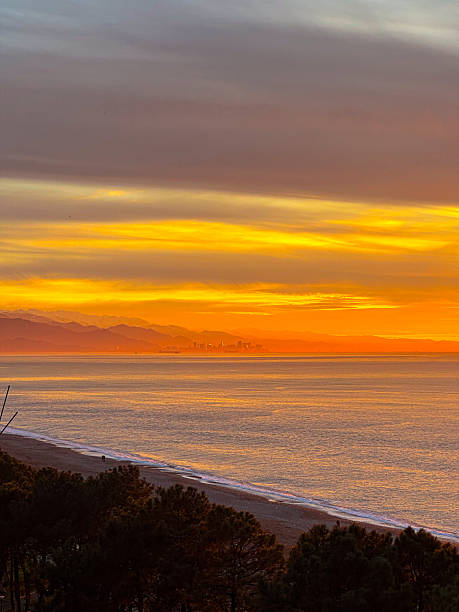 istock Golden Sunset Sea View Framed by Unfinished Building Structure 2250395175