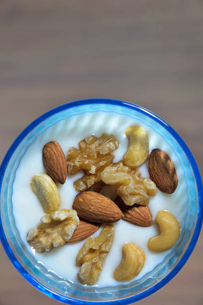 istock Yogurt topped with roasted mixed nuts 2250395844