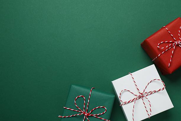 istock Top view of gift boxes on green background 2250396081