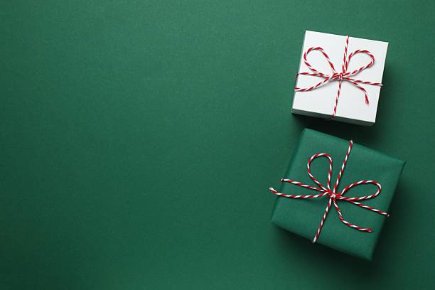 istock Beautiful gift boxes on color background 2250396123