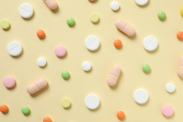 istock Various medical pills on a colored background 2250404494