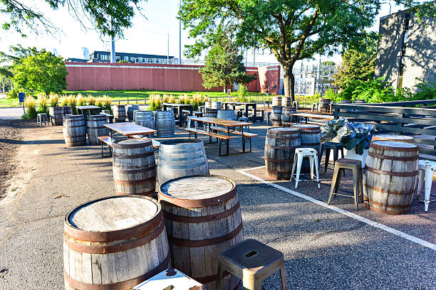 Summer Large Patio Setup with Barrels and Picnic Tables