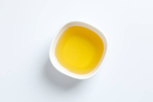 istock Bowl of fresh oil on white background 2250411226