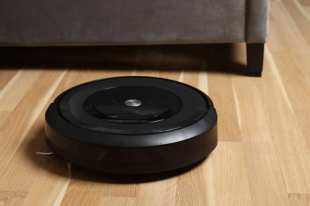 istock Robot vacuum cleaner on the floor in room 2250415244