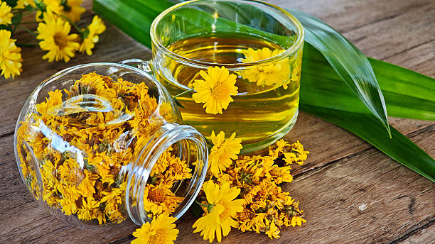 istock Chrysanthemum tea is a herbal drink on a wooden table. 2250418395